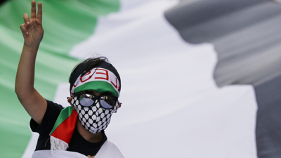 Neno con bandeira de Palestina nunha manifestación en Roma. Europa Press / Cecilia Fabiano